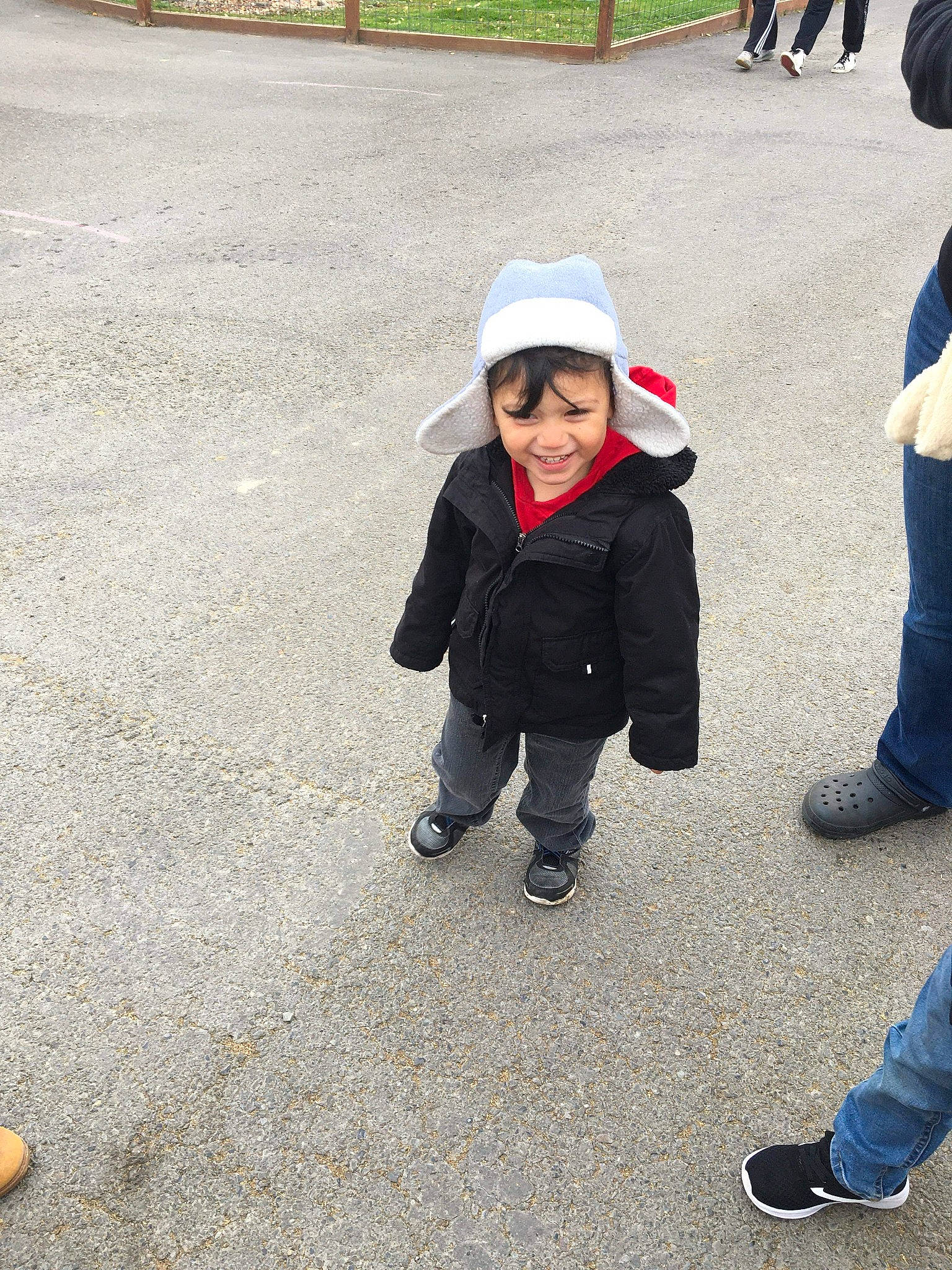 Fabian is registered to the contest to win money with this photo: child, fun, headwear, joy, outerwear, person, play, recreation, shoe, smile, toddler, tourism, vacation, walking