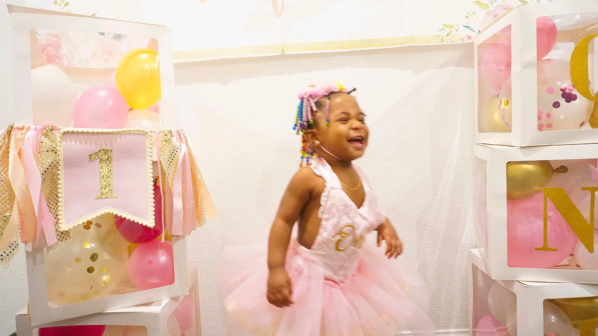 Legacy is registered to the contest to win money with this photo: balloon, child, dress, entertainment, event, fashion_design, fun, happy, headpiece, magenta, party, party_supply, peach, person, pink, room, smile, sweetness, textile, toddler