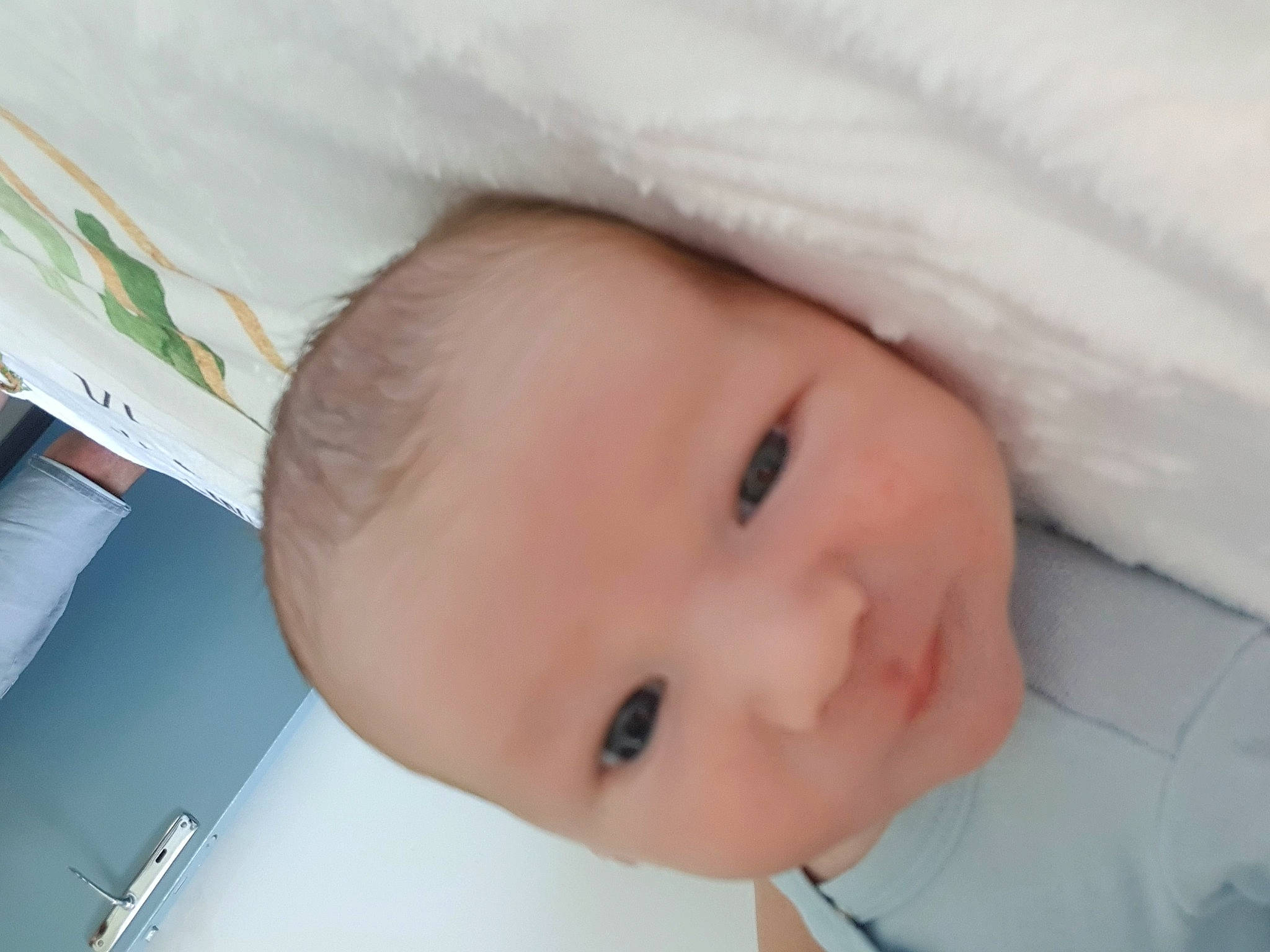 Quentin participe au concours pour gagner de l'argent avec cette photo : baby, baby_toddler_clothing, cheek, child, comfort, eye, eyebrow, eyelash, happy, iris, linens, nose, person, portrait_photography, room, skin, sleeve, toddler