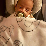Jan joined the competition — help win amazing prizes! baby, pacifier, blanket, soft, sleepy, infant, cozy, face, headrest, cushion, closeup, indoor, child, wrapped, comfort, nap, young, person, babywear, peaceful