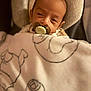 baby, pacifier, blanket, soft, sleepy, infant, cozy, face, headrest, cushion, closeup, indoor, child, wrapped, comfort, nap, young, person, babywear, peaceful