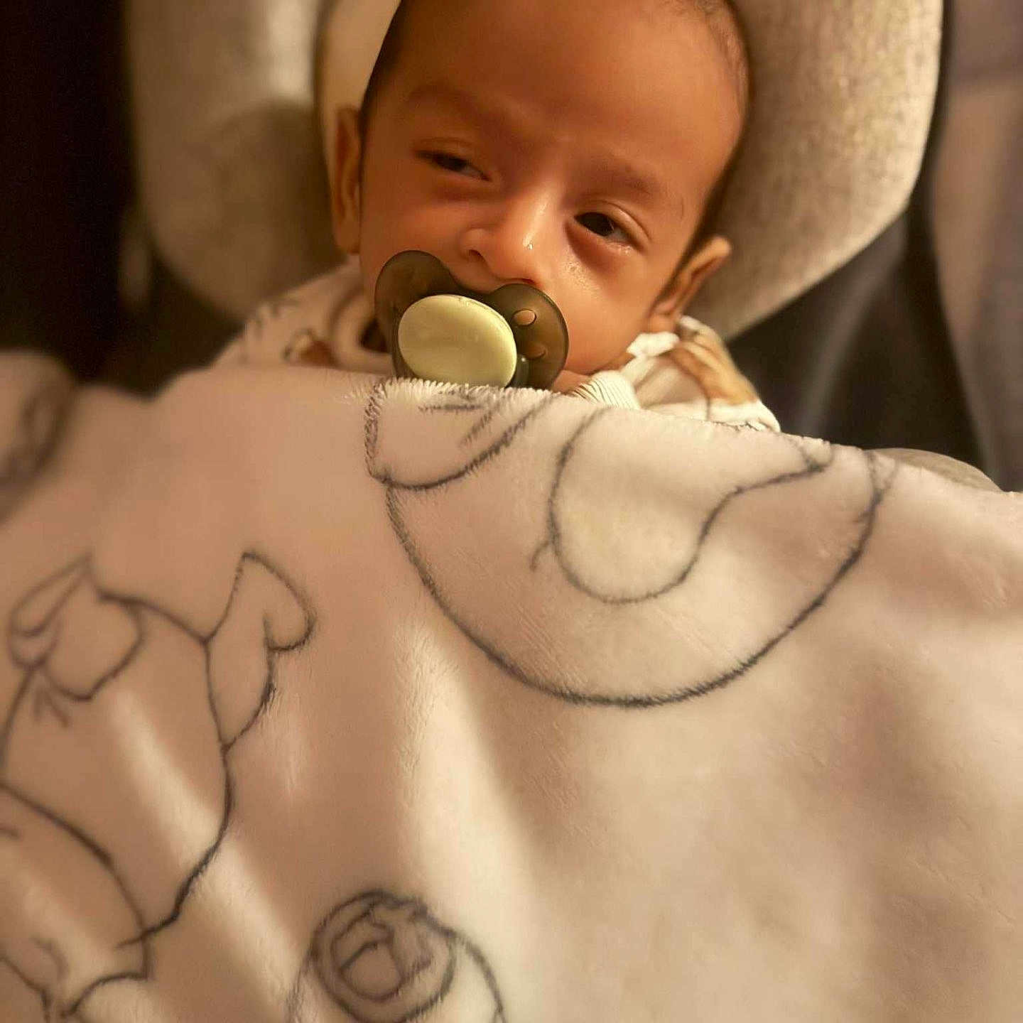 Jan joined the competition — help win amazing prizes! baby, babywear, blanket, child, closeup, comfort, cozy, cushion, face, headrest, indoor, infant, nap, pacifier, peaceful, person, sleepy, soft, wrapped, young