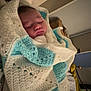 Archie is registered to the contest to win money with this photo: baby, sleeping, blanket, crochet, wrapped, cozy, indoors, bedroom, peaceful, child, infant, soft_lighting, homedecor, furniture, resting, portrait, person, white, blue, blanket_pattern