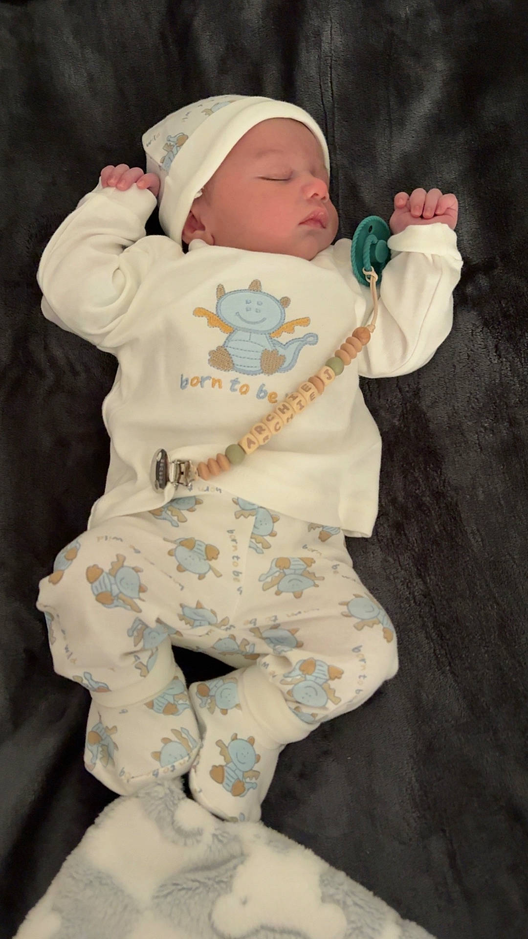 adorable, baby, blanket, blue, child, clothing, cozy, cute, hat, indoors, infant, lying_down, pacifier, pajamas, peaceful, resting, sleeping, soft, toddler, white