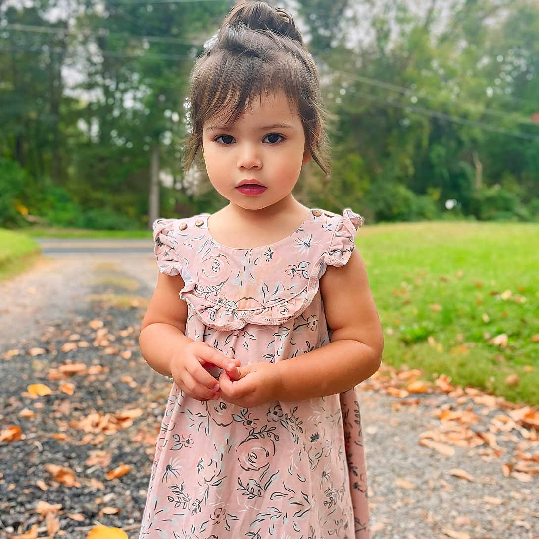 Layla is registered to the contest to win money with this photo: blackhair, brownhair, child, clothing, dress, eveningdress, face, female, formalwear, girl, hair, happy, head, person, photography, portrait, sitting, sleeve, smile, standing