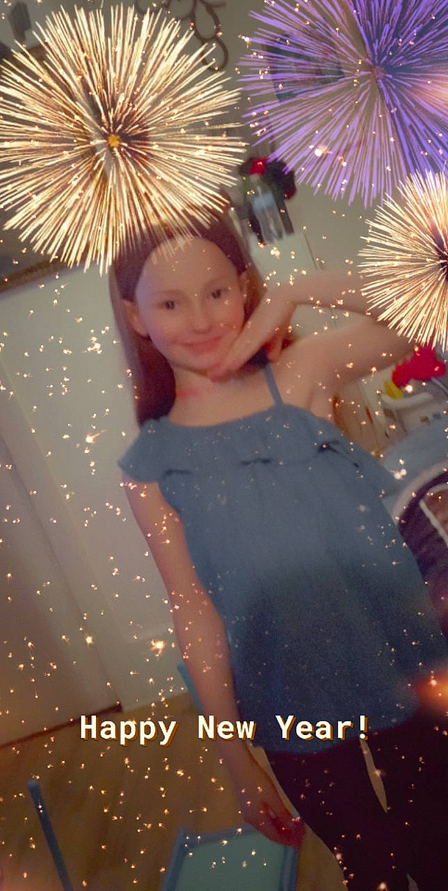 Emily Myjesta is registered to the contest to win money with this photo: christmas, christmas_ornament, electric_blue, event, fireworks, flash_photography, fun, happy, holiday, joy, light, lighting, midnight, new_year, party_supply, pattern, people_in_nature, person, pink, plant