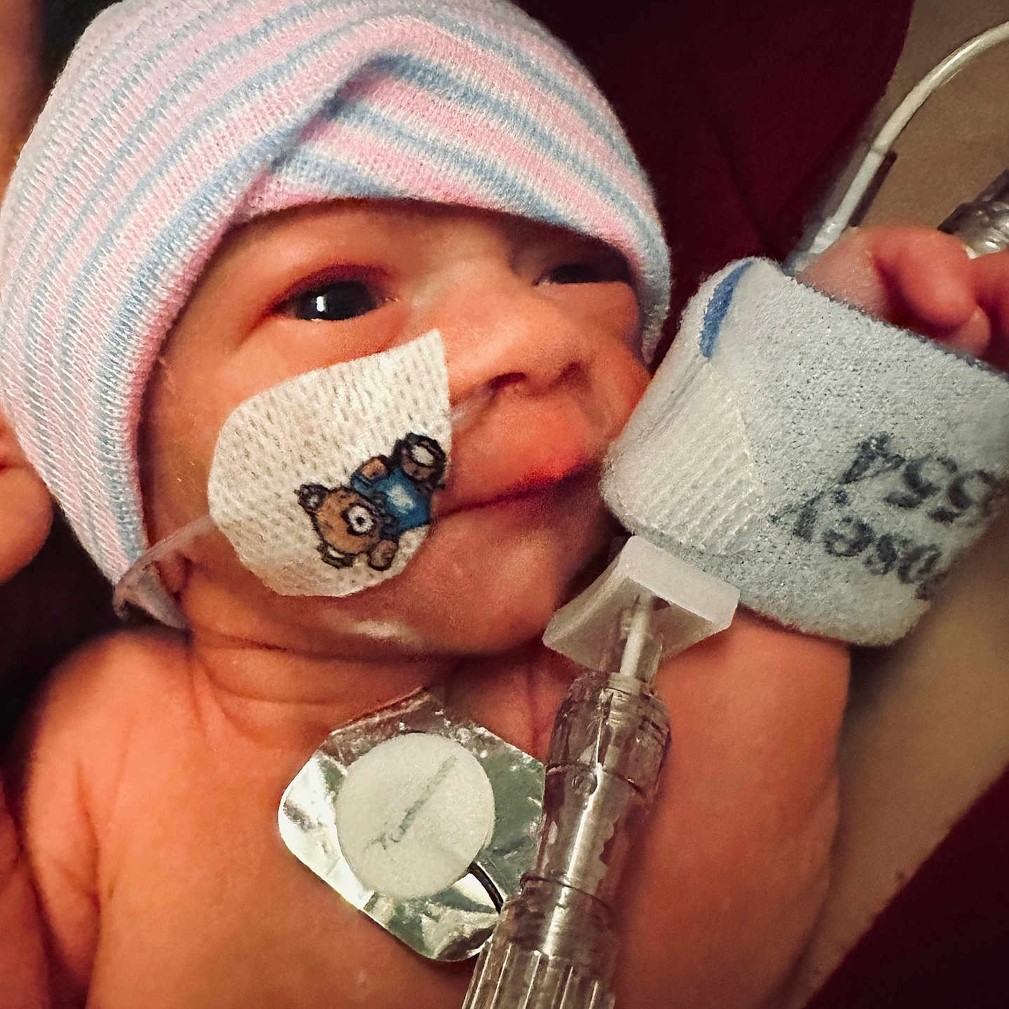 Logan joined the competition — help win amazing prizes! architecture, baby, blade, bodypart, building, cap, clothing, face, finger, glove, hand, hat, head, hospital, newborn, person, photography, portrait, razor, weapon