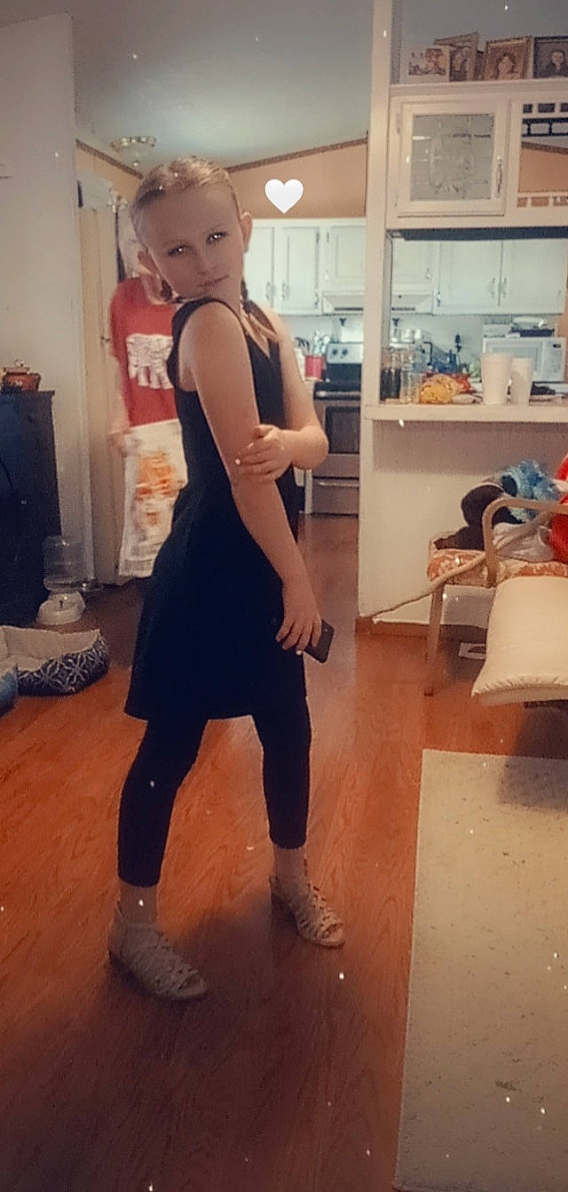 Miaya is registered to the contest to win money with this photo: abdomen, balance, chest, elbow, eyewear, fashion_design, floor, flooring, fun, hardwood, human_leg, knee, person, personal_protective_equipment, sportswear, standing, t_shirt, thigh, trunk, waist