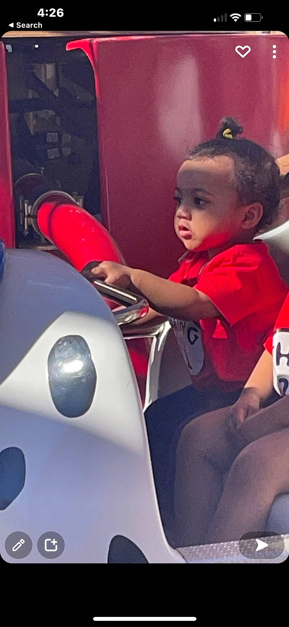 Kaylynn joined the competition — help win amazing prizes! auto_part, automotive_design, automotive_exterior, baby, carmine, child, family_car, fun, happy, human_leg, leisure, motor_vehicle, person, product, recreation, sitting, steering_wheel, t_shirt, toddler, vehicle_door