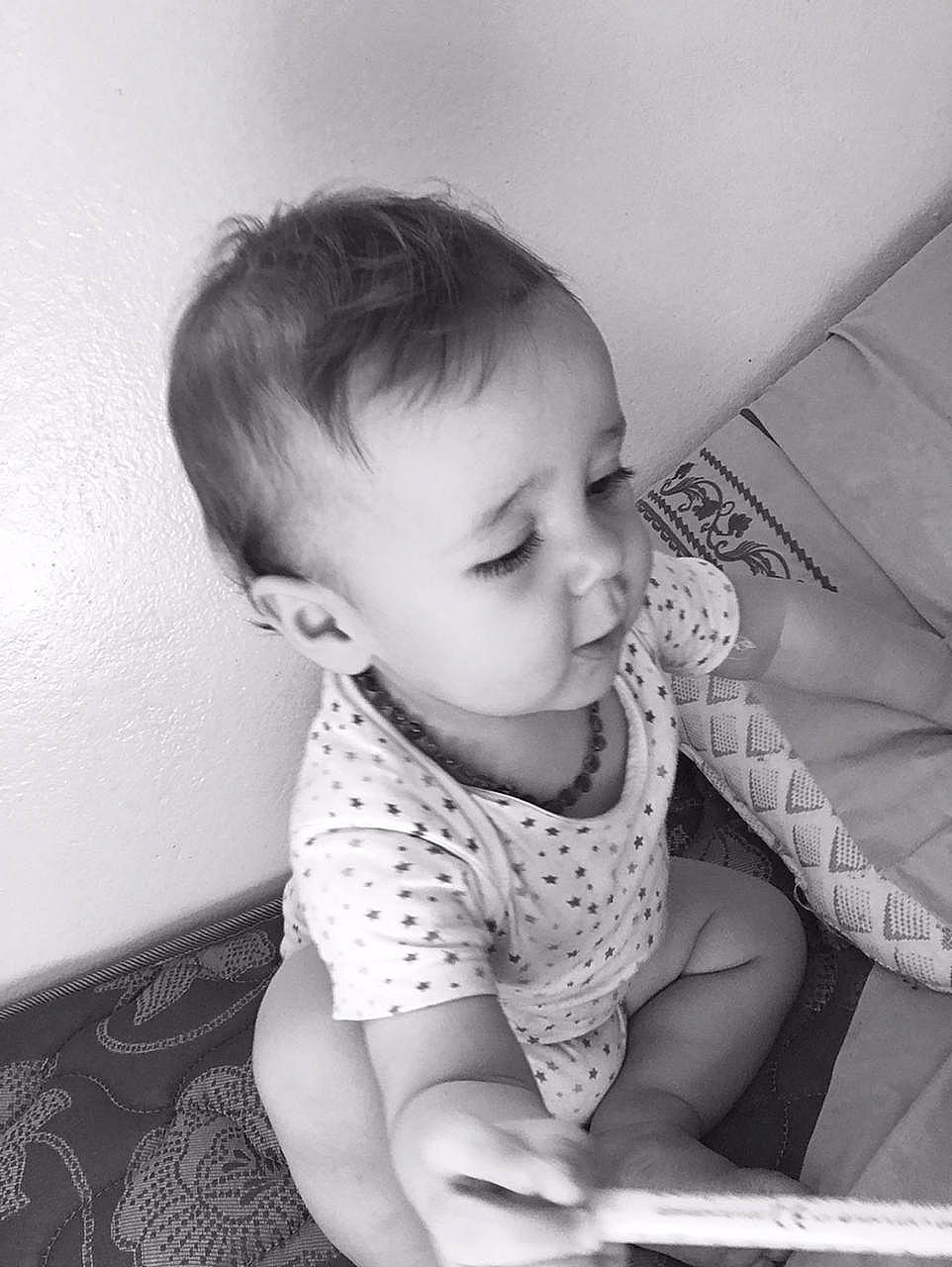 Rayan participe au concours pour gagner de l'argent avec cette photo : arm, baby, baby_toddler_clothing, black, cheek, comfort, finger, flash_photography, hairstyle, hand, human_body, iris, leg, mouth, nose, person, product, skin, sleeve, smile