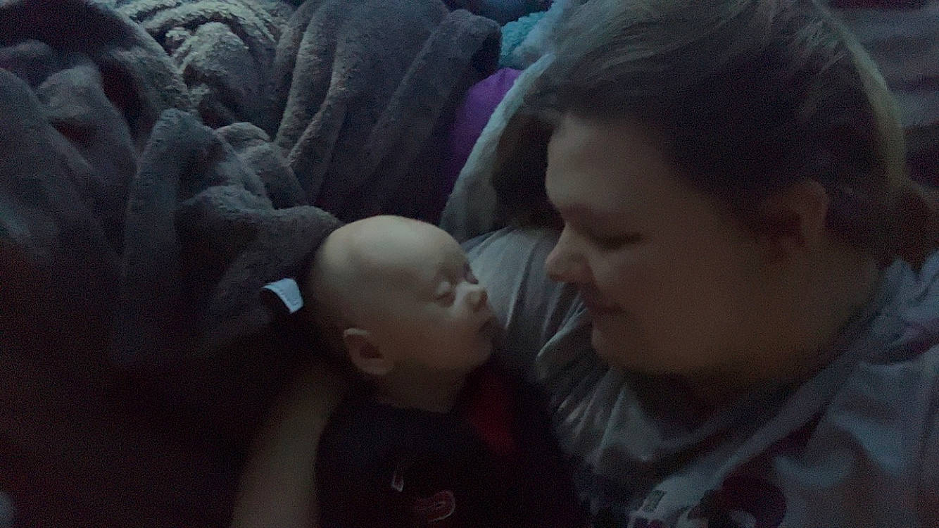 Brandon is registered to the contest to win money with this photo: baby, child, comfort, darkness, ear, flash_photography, fun, gesture, linens, mouth, night, nose, person, room, sitting, toddler, tree, under_exposed