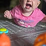 baby, child, headband, pink_shirt, play_mat, toys, indoor, closeup, expression, mouth_open, blue_eyes, cute, infant, young_child, portrait, colorful, blurred_background, focus, happy, playtime