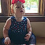 toddler, child, baby, indoor, window, wooden_floor, dress, headband, bow, curious, sitting, footwear, red, blue, white, pattern, natural_light, portrait, person, young_child