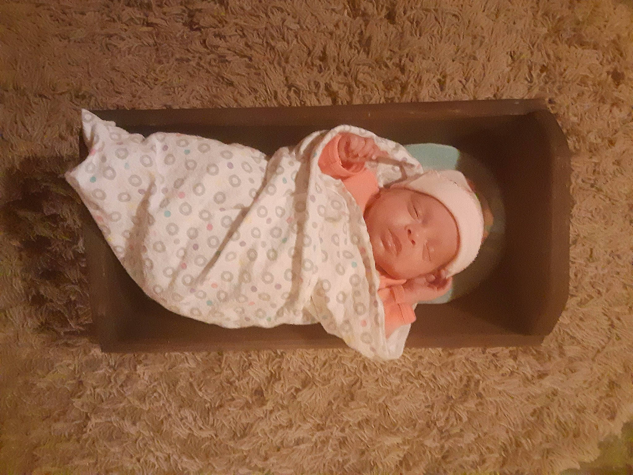 Ryver is registered to the contest to win money with this photo: baby, baby_products, baby_sleeping, baby_toddler_clothing, beanie, cap, cheek, child, comfort, hat, headgear, helmet, knit_cap, linens, person, sitting, skin, sleeve, toddler, wood