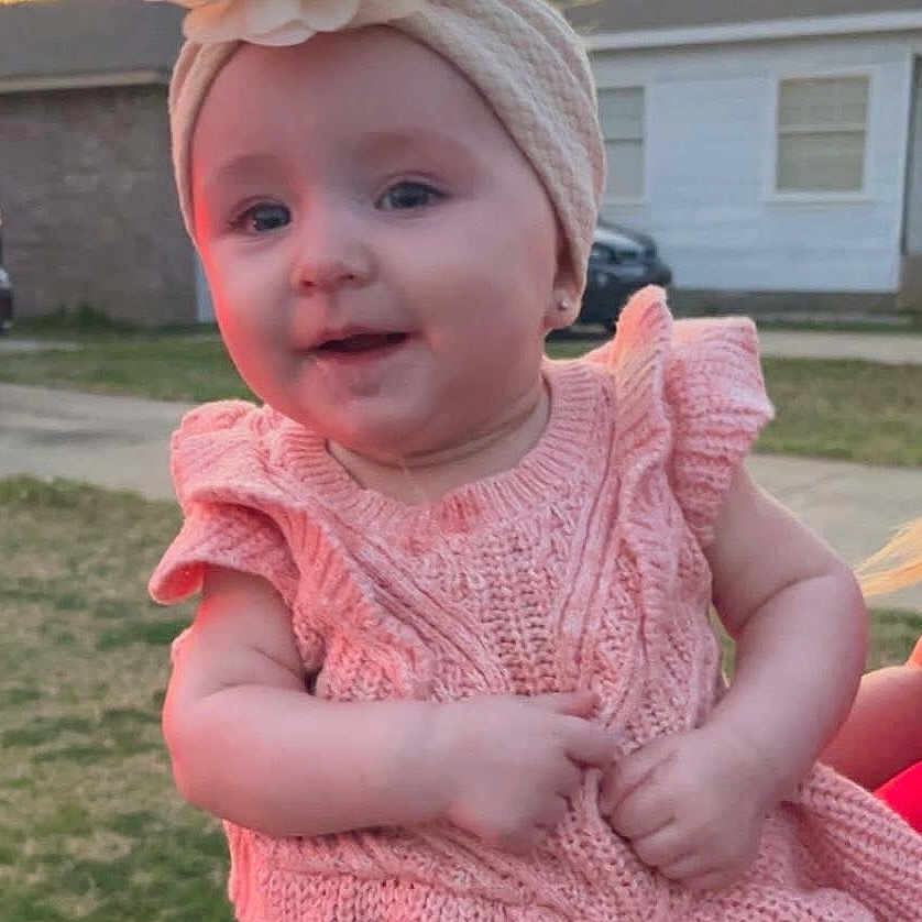 Delaney is registered to the contest to win money with this photo: adorable, baby, car, child, cute, face, flower_headband, girl, grass, hands, headband, house, infant, knit_dress, outdoor, pink_dress, portrait, smile, sunset, yard