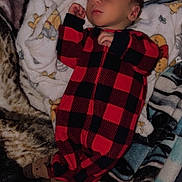 Buckley joined the competition — help win amazing prizes! baby, sleeping, infant, onesie, red_and_black, checkered, blanket, soft, cozy, peaceful, cute, child, rest, indoor, portrait, young, person, comfort, nap, warm