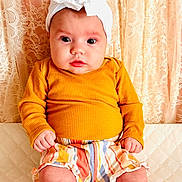 Joy joined the competition — help win amazing prizes! baby, bodypart, bonnet, cap, clothing, couch, face, finger, furniture, hand, hat, head, knitwear, person, photography, portrait, shorts, sitting, sleeve, sweater