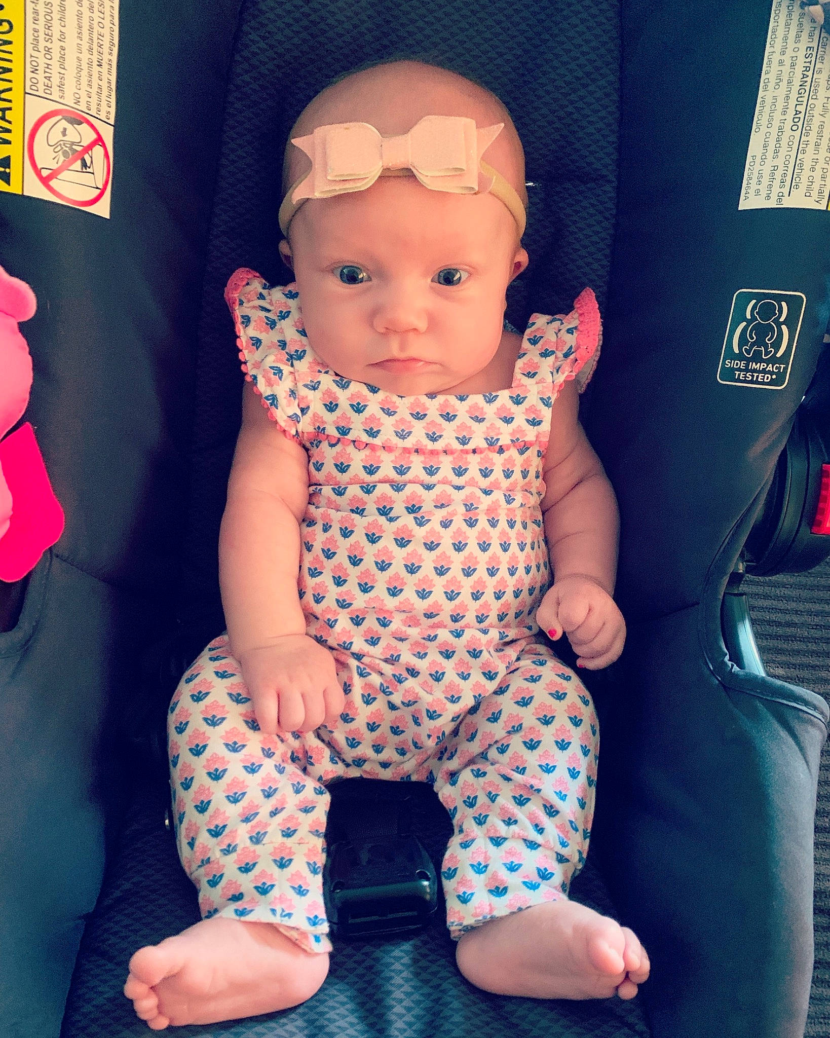 Regan is registered to the contest to win money with this photo: baby, baby_toddler_clothing, cheek, child, design, eye, face, head, pattern, person, pink, polka_dot, sitting, skin, smile, toddler