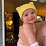 baby, infant, smile, yellow_hat, diaper, white_sock, arm, hand, mirror, room, clutter, box, huggies, reflection, indoor, person, holding, cute, happy, child