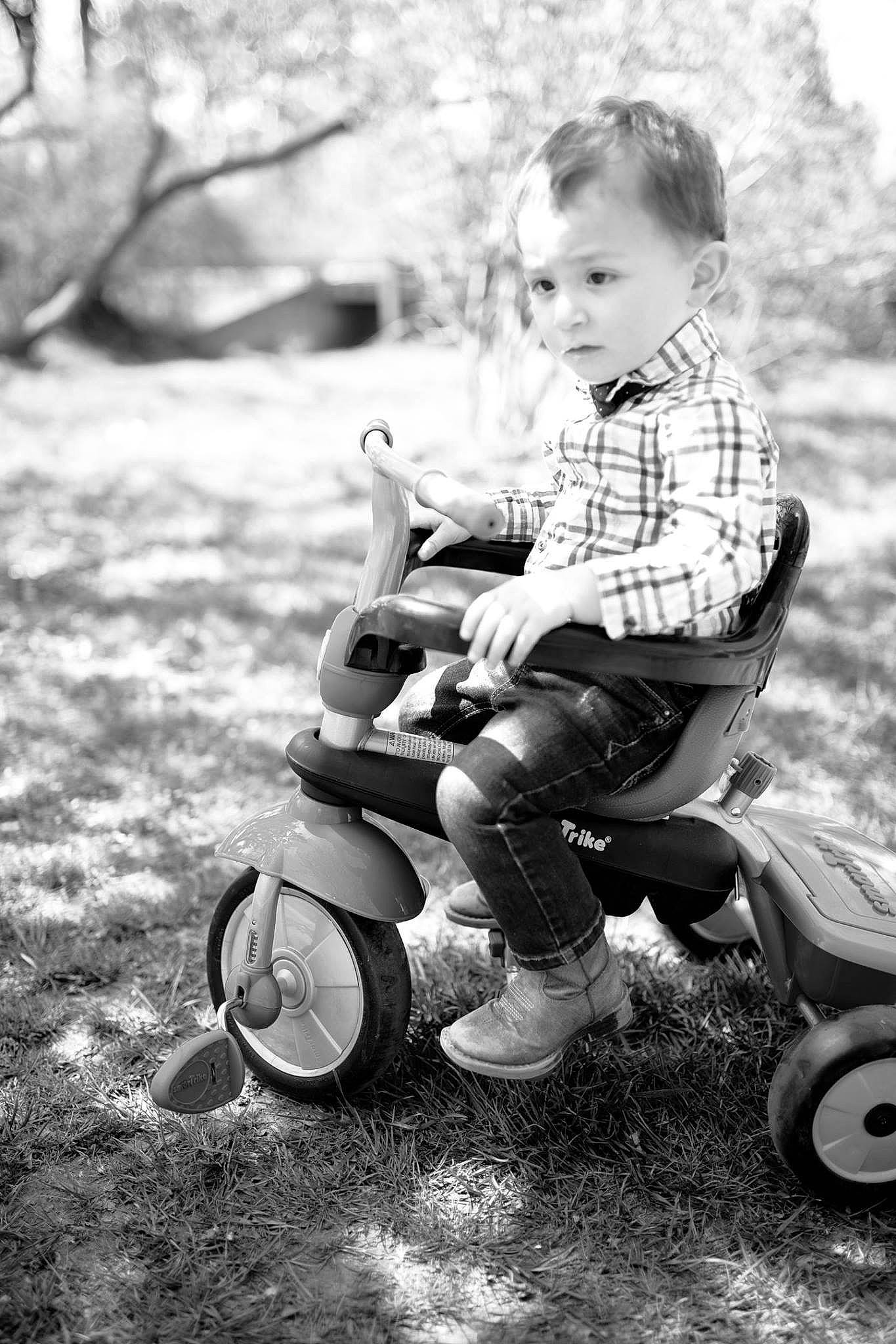Trenton is registered to the contest to win money with this photo: black_and_white, child, monochrome, monochrome_photography, person, photograph, photography, play, portrait_photography, sibling, sitting, smile, stock_photography, style, toddler, vehicle