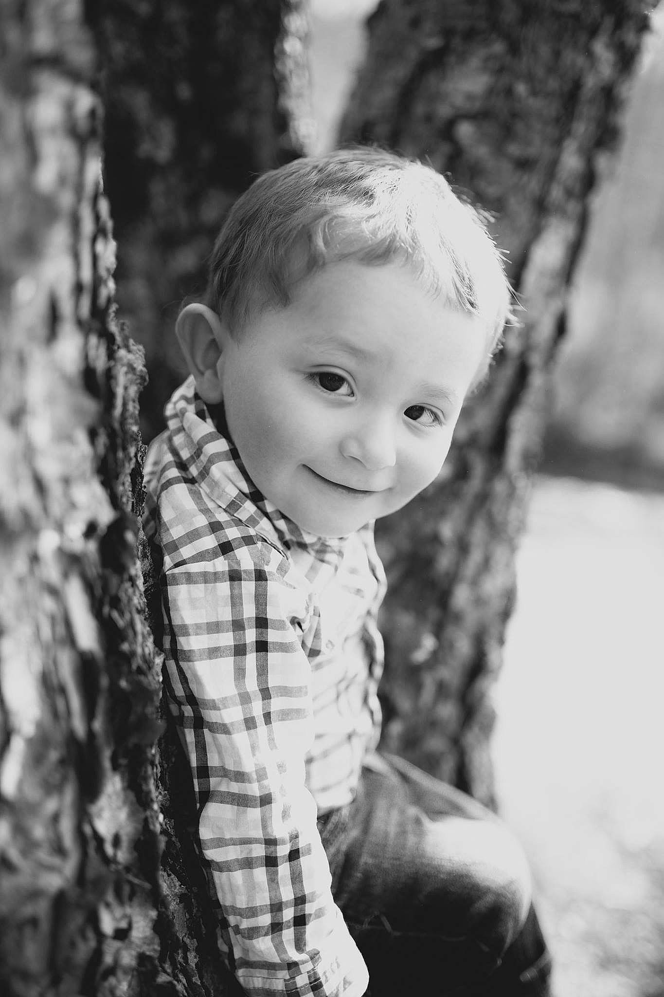 Trenton is registered to the contest to win money with this photo: black, black_and_white, child, child_model, eye, face, iris, male, monochrome, monochrome_photography, people, person, photograph, photography, plant, portrait, portrait_photography, standing, toddler, tree