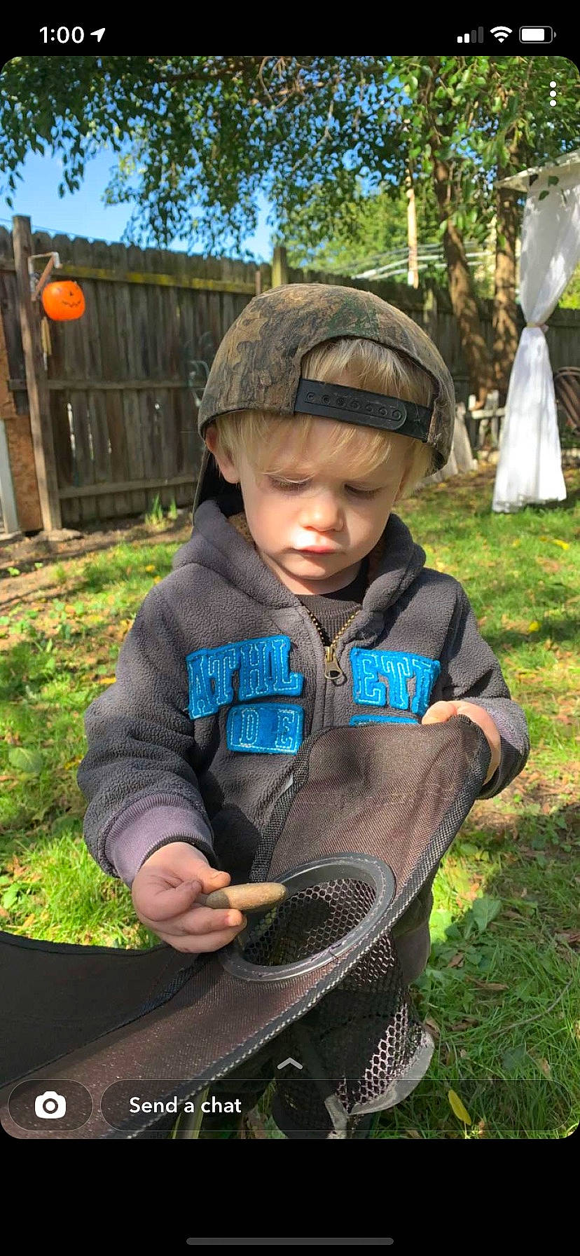 Aron is registered to the contest to win money with this photo: cap, child, denim, fashion_accessory, garden, grass, headgear, headwear, lawn, leisure, mammal, outerwear, pattern, people_in_nature, person, plant, recreation, sitting, sleeve, soil