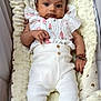 baby, infant, child, cushion, white_pants, patterned_top, bracelet, cute, soft_texture, indoor, portrait, laying_down, comfortable, clothing, person, young_child, closeup, sleeping_bed, baby_fashion, adorable