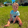 toddler, child, grass, outdoor, sunny, barefoot, blue_eyes, smile, short_sleeve_shirt, dinosaur_print, lawn, suburban, house, stop_sign, daytime, greenery, happy, cute, person, portrait