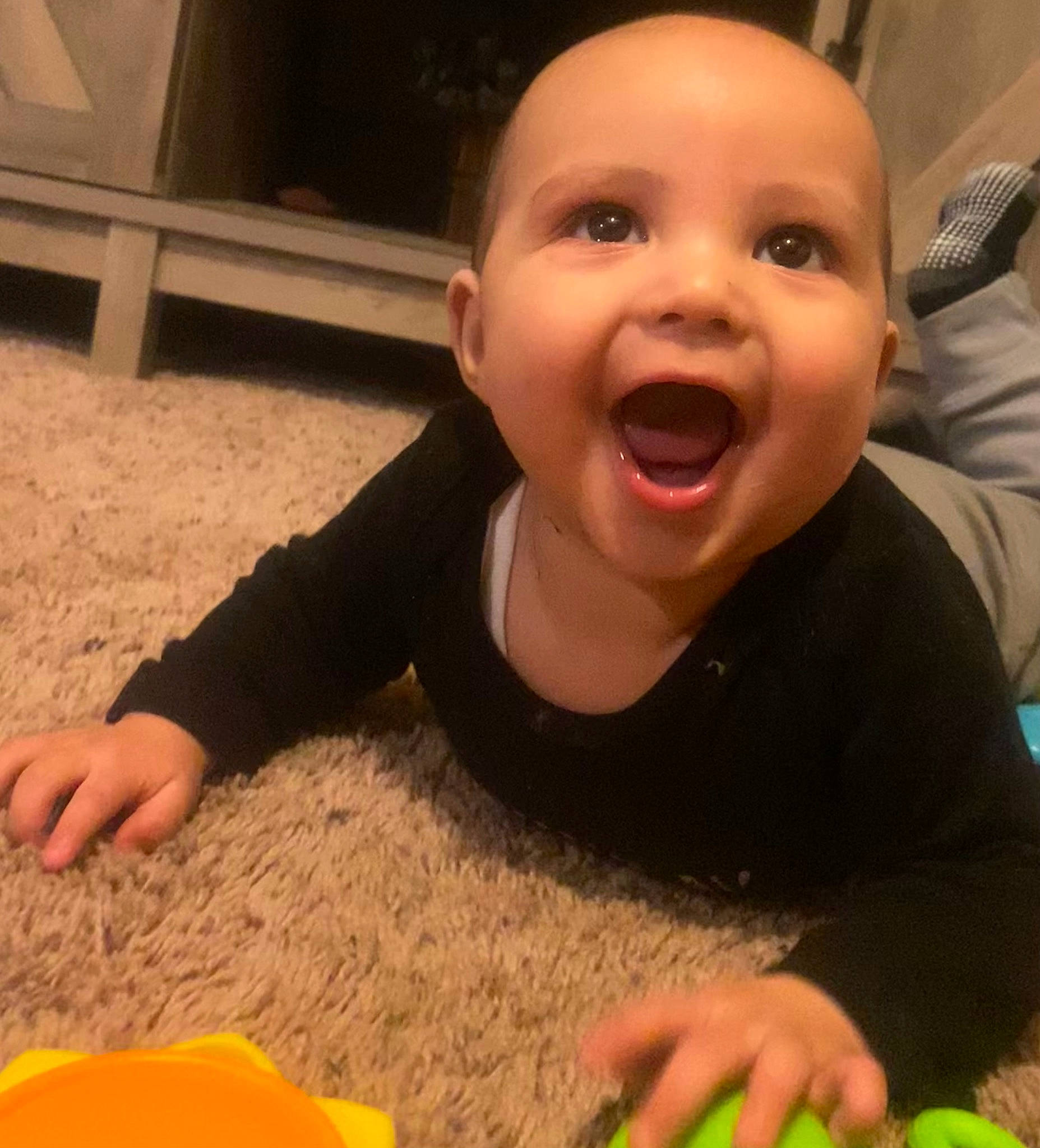 Damian is registered to the contest to win money with this photo: baby, baby_laughing, child, cloud, finger, flooring, fun, grass, happy, laugh, nail, nose, person, play, recreation, sharing, sitting, smile, t_shirt, thumb