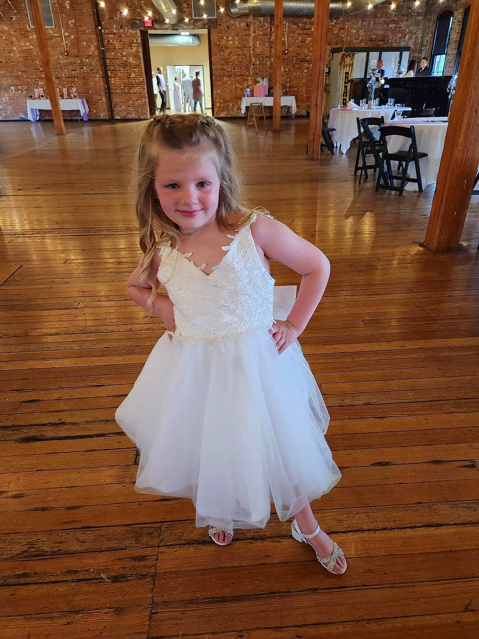 Makenlie joined the competition — help win amazing prizes! bridal_clothing, chair, dress, event, fashion_design, flash_photography, floor, flooring, formal_wear, happy, hardwood, human_leg, joy, one_piece_garment, person, shoulder, skin, smile, toddler, trunk