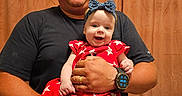 Bena joined the competition — help win amazing prizes! baby, casual_clothing, child, curtain, family, father, happy, headband, holding, human, indoor, infant, man, people, person, portrait, red_dress, smile, star_pattern, watch