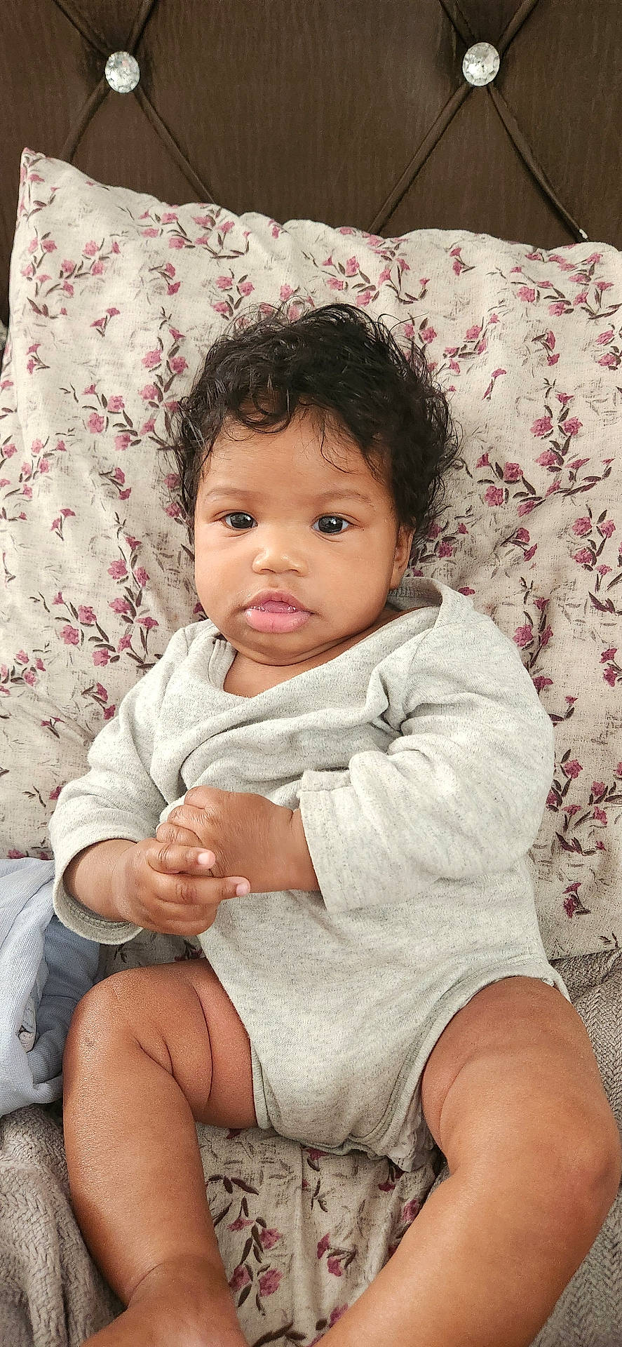 baby, blanket, bodypart, clothing, couch, cushion, face, finger, furniture, hand, happy, head, homedecor, pants, person, photography, portrait, shorts, sitting, smile