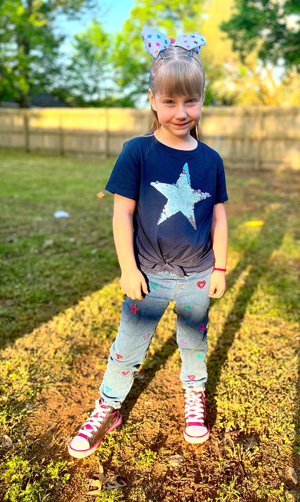 Kathryn is registered to the contest to win money with this photo: cool, denim, electric_blue, eye, face, grass, hair, hairstyle, happy, head, joy, knee, leaf, person, recreation, sleeve, sportswear, street_fashion, summer, sunlight