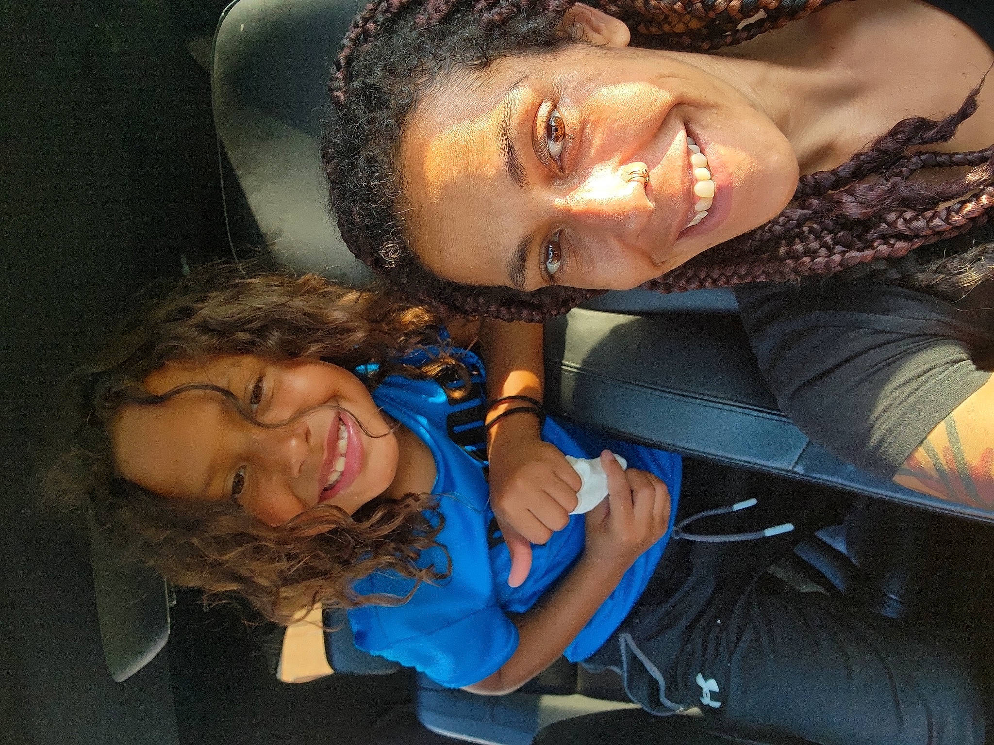 Dawson is registered to the contest to win money with this photo: arm, automotive_design, black_hair, comfort, cool, eye, face, facial_expression, flash_photography, fun, gesture, happy, human, joy, leisure, mouth, muscle, organ, person, smile