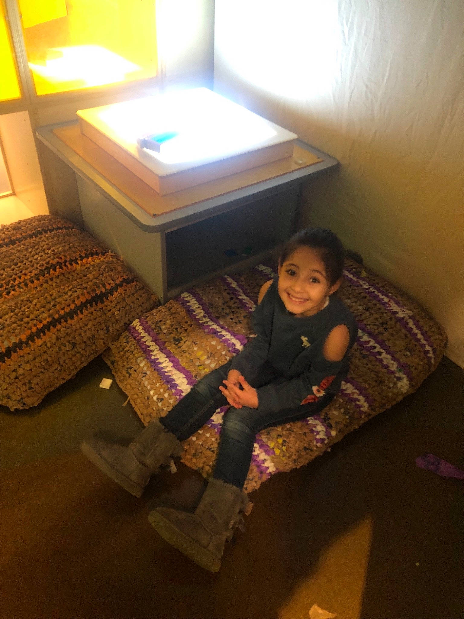 Tia is registered to the contest to win money with this photo: child, comfort, couch, floor, flooring, furniture, house, joy, person, room, sitting, toddler, wood