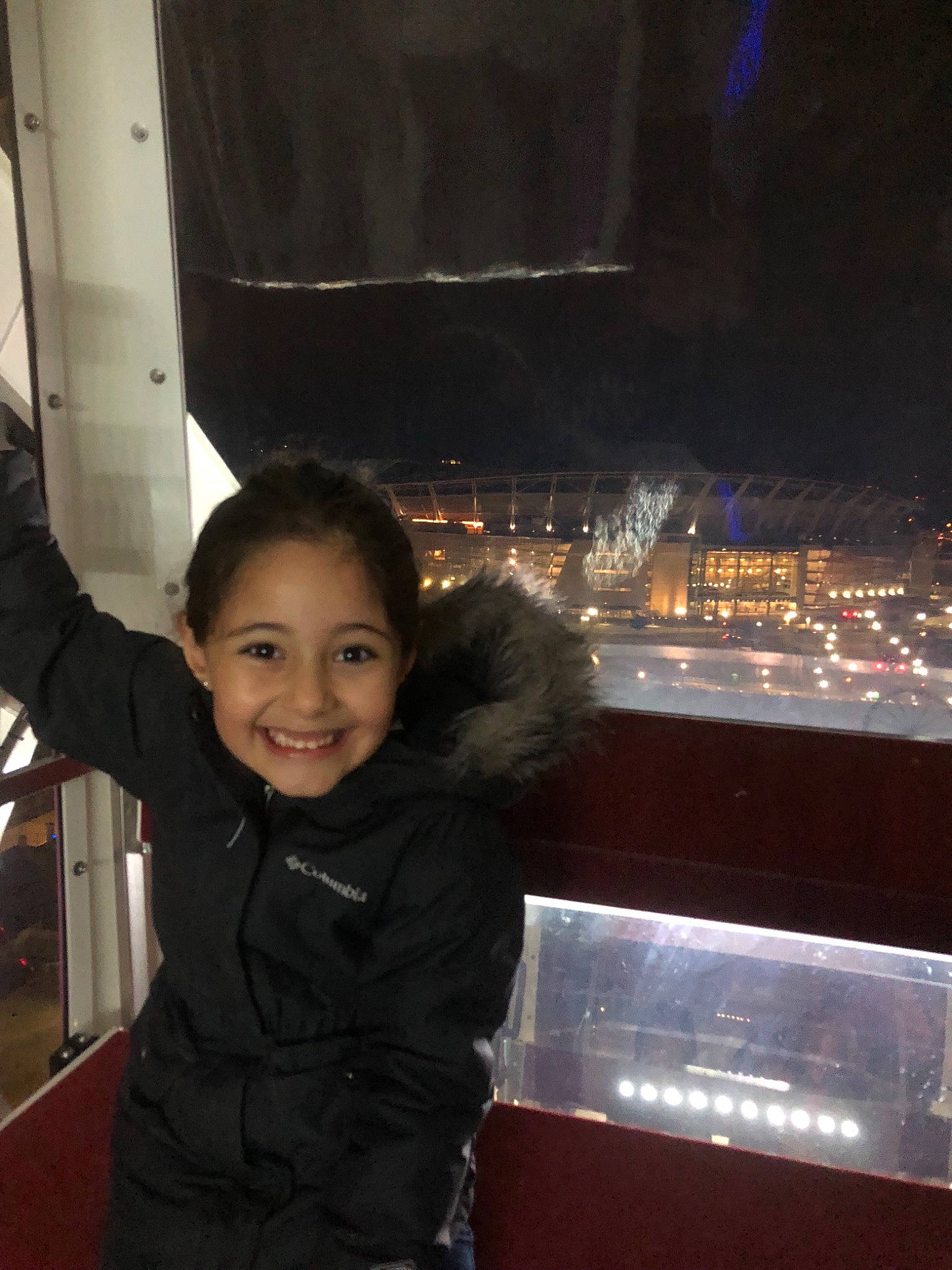 Tia is registered to the contest to win money with this photo: child, fun, joy, night, person, photography, sky, smile, toddler, tourism, tourist_attraction, vacation