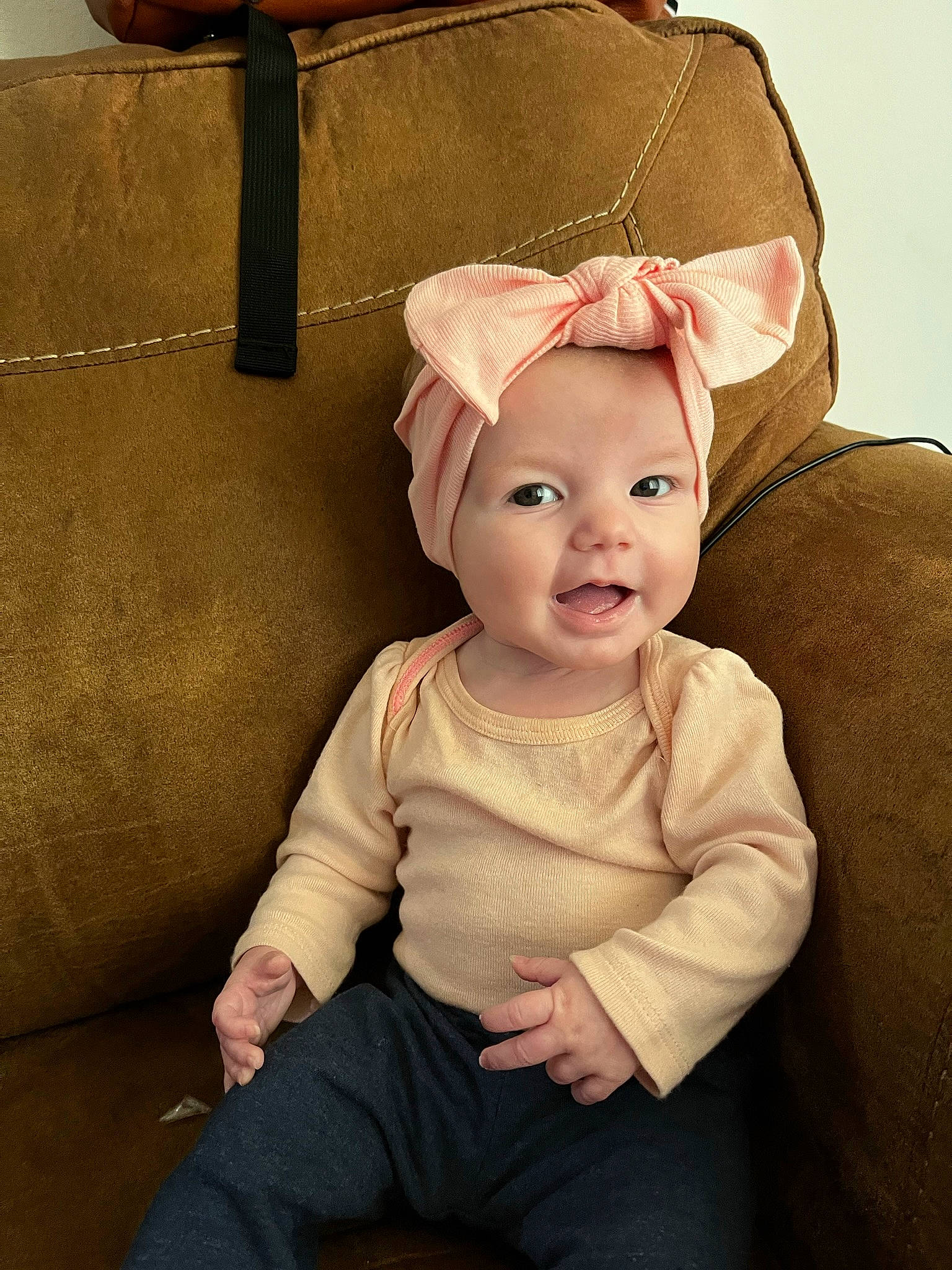 Daisy is registered to the contest to win money with this photo: baby, baby_toddler_clothing, cheek, child, chin, clothing, comfort, costume_hat, fashion_accessory, flash_photography, happy, magenta, person, pink, portrait_photography, room, sitting, skin, sleeve, smile