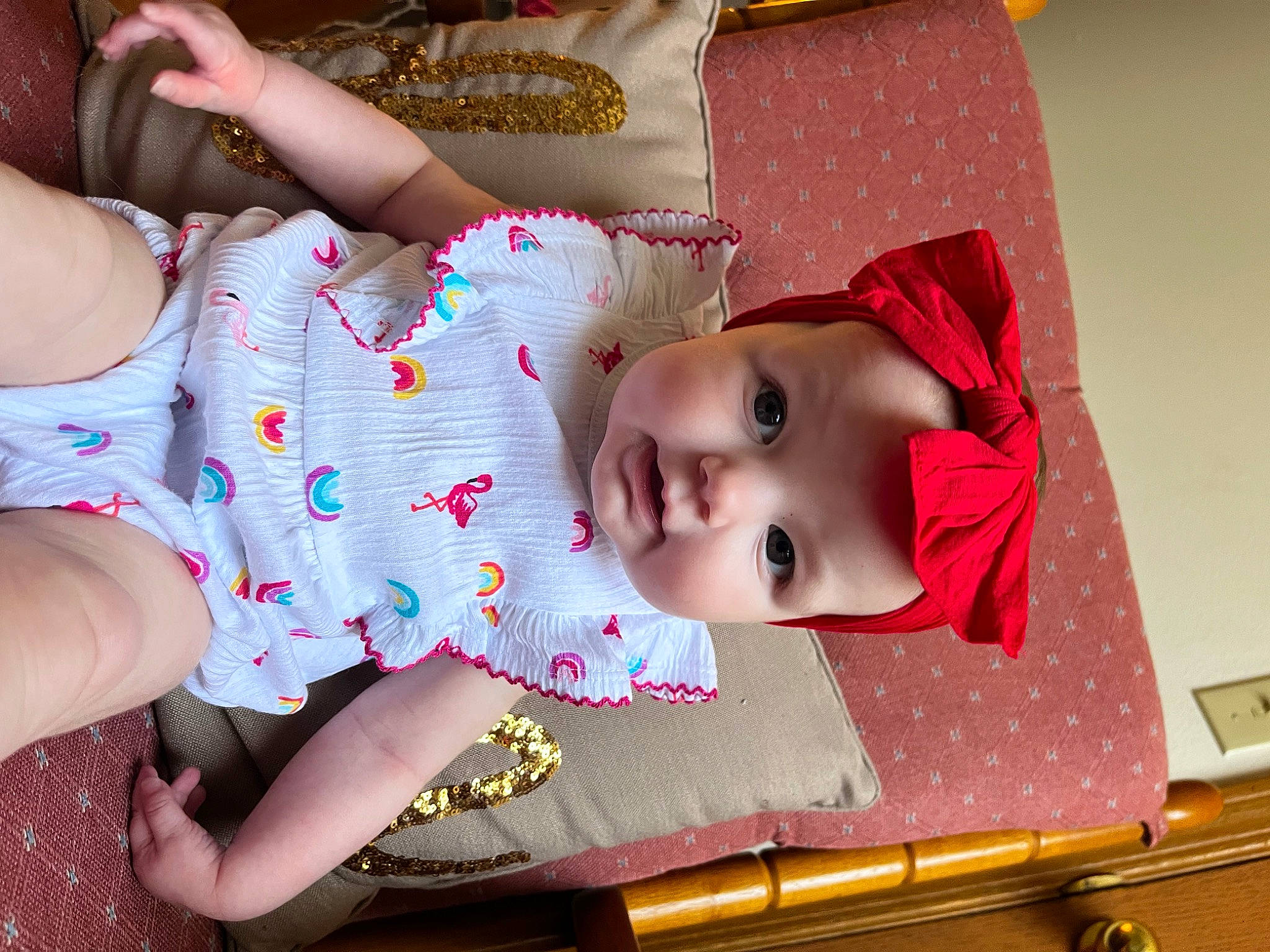 Daisy is registered to the contest to win money with this photo: baby, baby_toddler_clothing, carmine, cheek, child, eyelash, fashion_accessory, foot, happy, headwear, human_leg, lip, magenta, pattern, person, pink, skin, sleeve, thigh, toddler