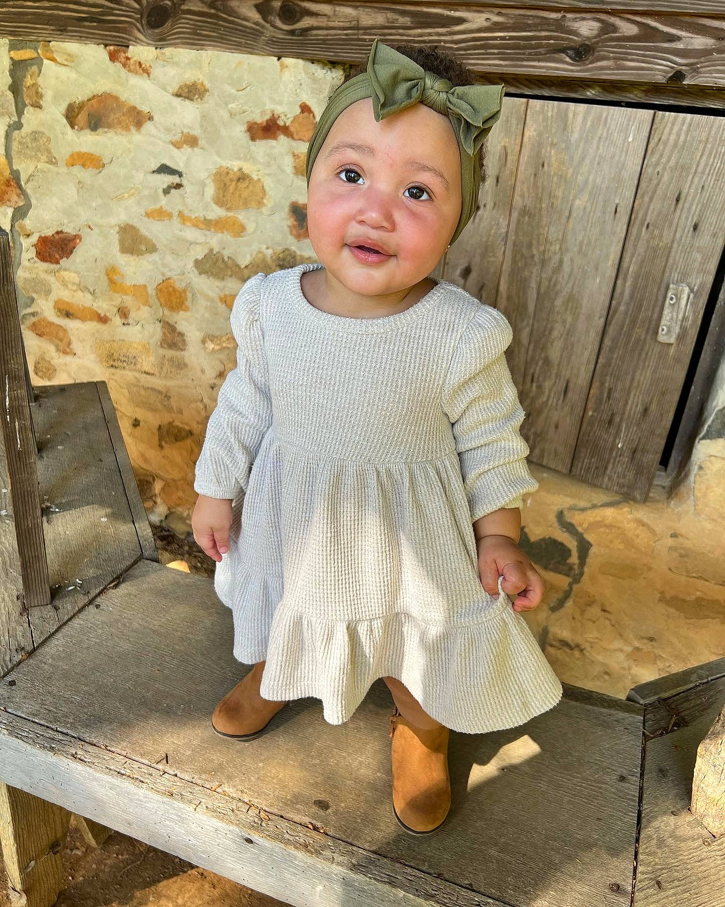 Princess is registered to the contest to win money with this photo: baby, baby_toddler_clothing, chair, child, day_dress, dress, face, flash_photography, foot, happy, head, human_body, human_leg, pattern, person, sitting, sleeve, smile, t_shirt, toddler
