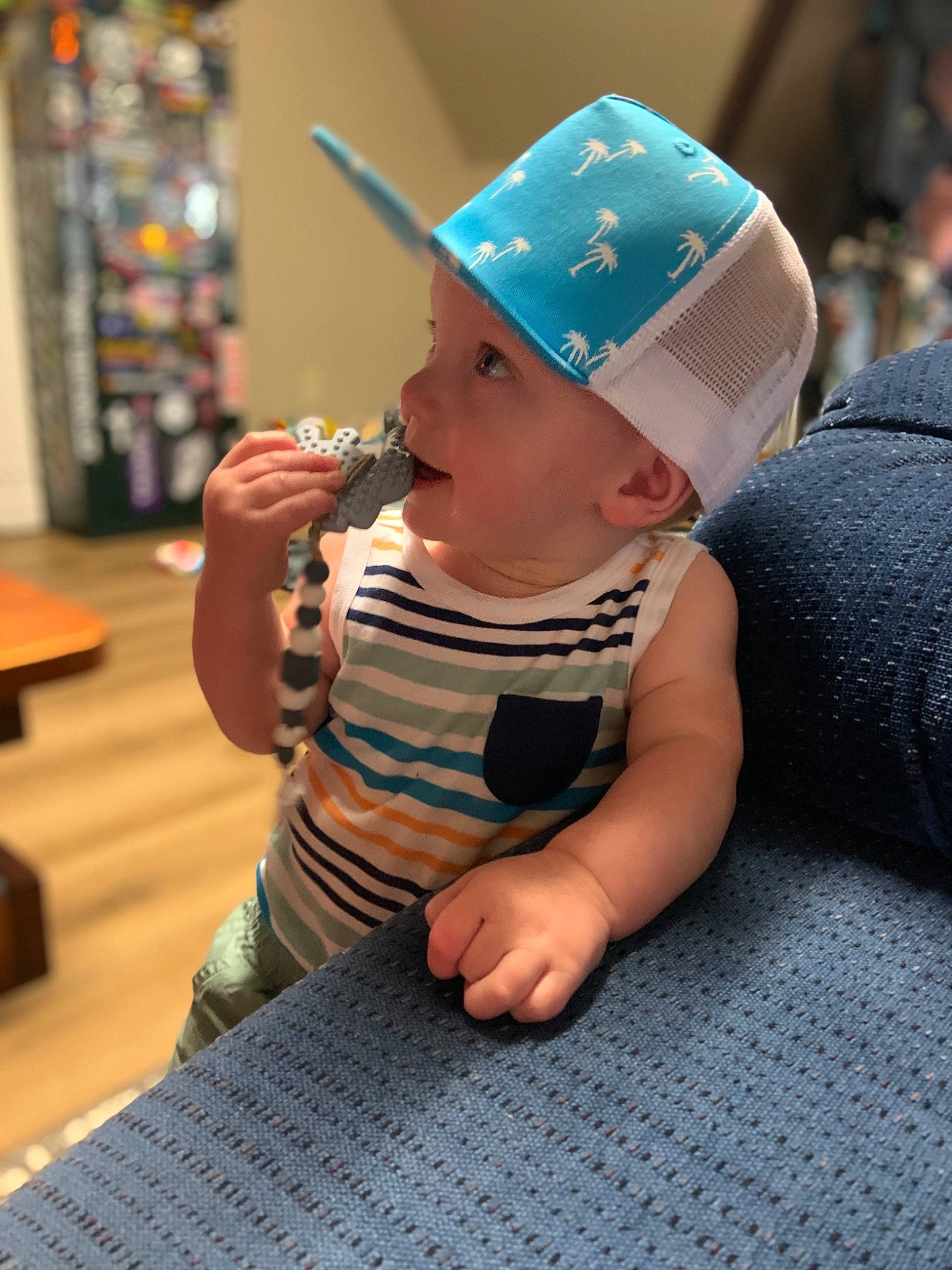 Noah joined the competition — help win amazing prizes! baby, baby_toddler_clothing, baseball_cap, cap, child, electric_blue, fashion_accessory, finger, flooring, fun, happy, hardwood, hat, headwear, leisure, person, room, sitting, skin, sun_hat