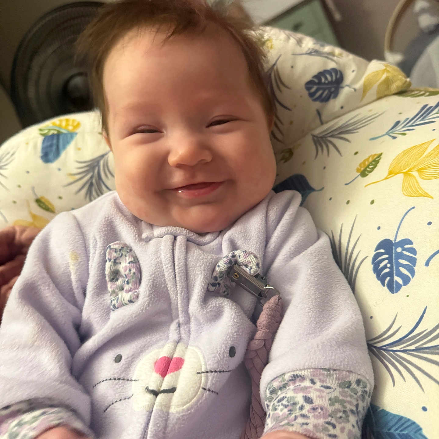 Lilah is registered to the contest to win money with this photo: baby, bodypart, clothing, couch, cushion, face, finger, furniture, hand, happy, head, homedecor, knitwear, newborn, pattern, person, photography, portrait, smile, sweater