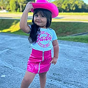 Dulce Maria is registered to the contest to win money with this photo: blackhair, child, clothing, face, female, girl, hair, happy, hat, head, person, racket, shorts, sleeve, smile, sombrero, sport, standing, tennis, tennisracket