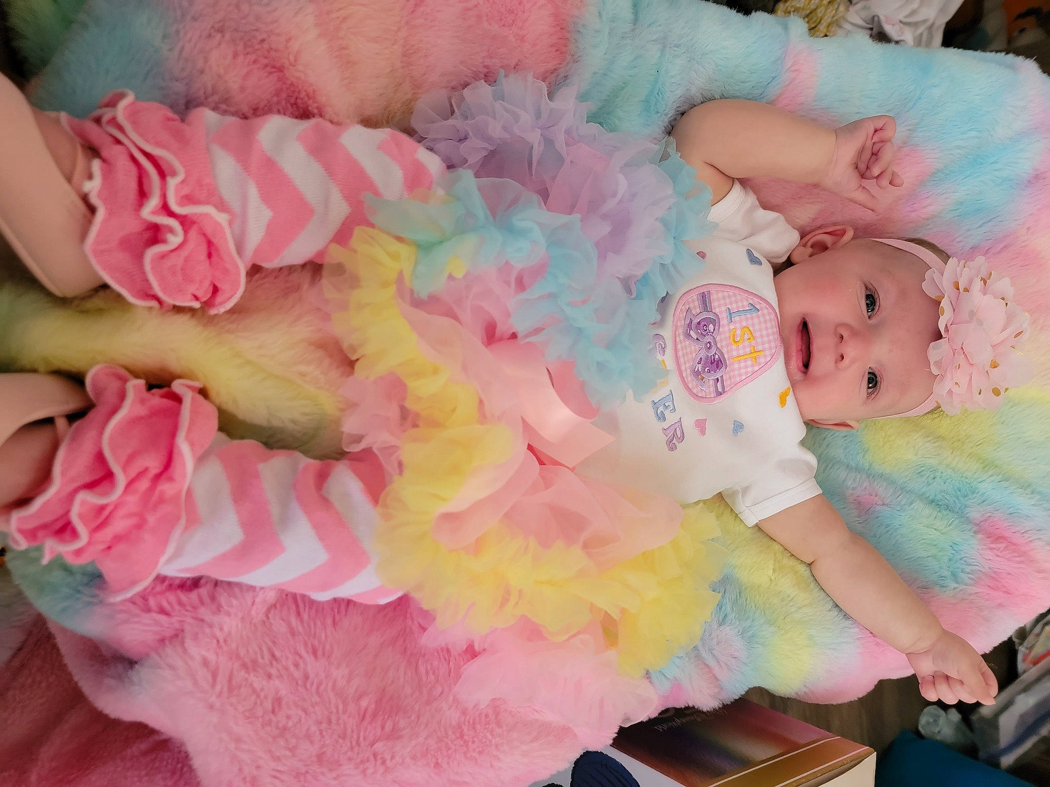 Raelynn is registered to the contest to win money with this photo: baby, baby_products, baby_toddler_clothing, child, event, fashion_accessory, hair_accessory, happy, headgear, headwear, magenta, pattern, peach, person, petal, pink, plant, room, rose_family, sweetness