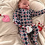 Kash is registered to the contest to win money with this photo: baby, infant, onesie, heart_pattern, blanket, beads, heart_shaped, love, xoxo, cute, cozy, sleepwear, child, face, person, soft, warm, resting, newborn, indoors