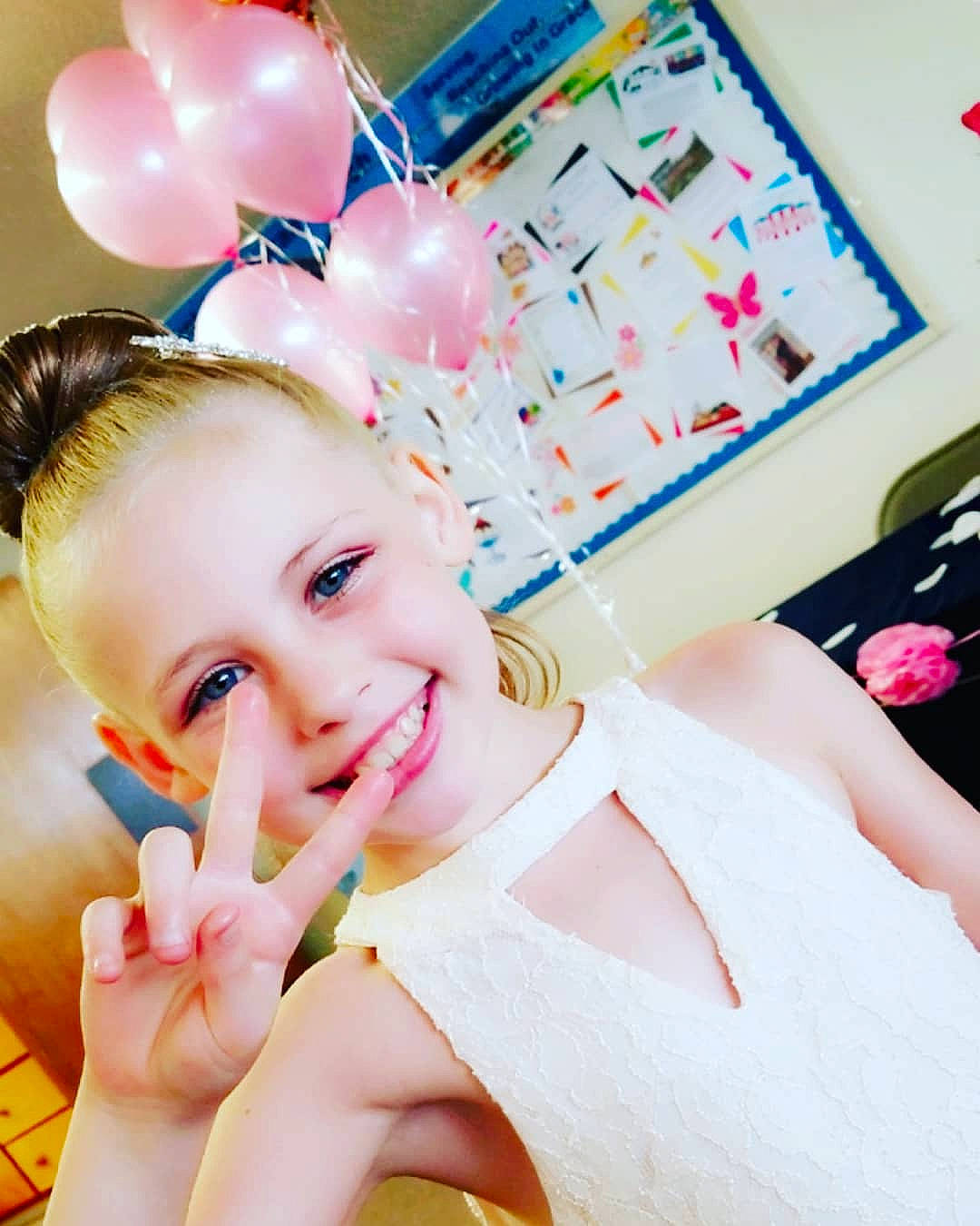 Nevaeh joined the competition — help win amazing prizes! beauty, child, ear, eyelash, finger, girl, hair_accessory, hand, happiness, joy, person, petal, pink, product, skin, smile