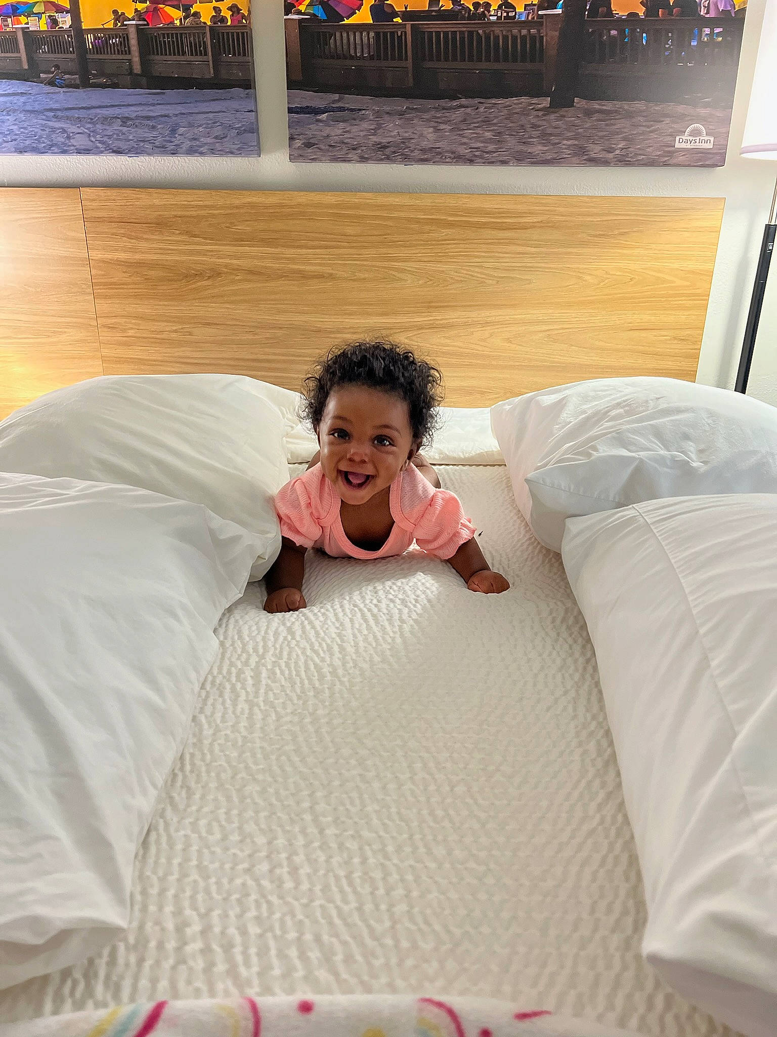 Melony is registered to the contest to win money with this photo: bedding, bedroom, bedtime, child, comfort, flooring, fun, happy, human_body, leg, leisure, linens, nap, person, room, sitting, smile, t_shirt, textile, throw_pillow
