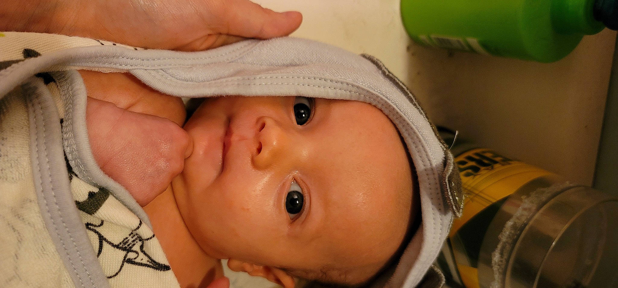 Draven is registered to the contest to win money with this photo: baby, cap, cheek, chin, eye, eyebrow, eyelash, finger, forehead, hand, hat, head, headgear, iris, lip, mouth, nose, person, skin, sun_hat