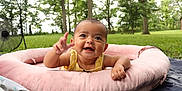 Cattaleya joined the competition — help win amazing prizes! baby, infant, smiling, outdoor, greenery, trees, grass, pink_cushion, happy, child, person, nature, summer, playtime, cute, face, hand, park, relaxing, sunlight