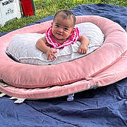Cattaleya joined the competition — help win amazing prizes! baby, infant, pink_clothing, smiling, face, outdoor, grass, blanket, cushion, pillow, cooler, toy, child, happy, lying_down, nature, relaxing, cute, people, daylight