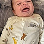 Kingsley is registered to the contest to win money with this photo: baby, babylaughing, bed, clothing, cushion, face, furniture, glove, happy, head, homedecor, laughing, newborn, pajamas, person, photography, portrait, quilt, shirt, smile